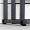 Close-up of the bottom section of a black metal towel rack, showing its legs and base. Náhľad obrázku produktu