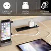 A close-up view of a desk with a power strip, a phone charging, and a tablet. Náhled obrázku produktu
