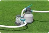 A pool pump and filter system sits on a green lawn. Produktbild-Vorschau