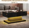 A modern living room setting with a black and gold coffee table with LED lighting. Produktbild-Vorschau