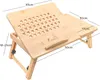 A wooden laptop table with adjustable legs and ventilation holes, shown from a slightly elevated angle. Podgląd zdjęcia produktu