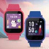 Two children's smartwatches, one pink and one blue, are displayed against a colorful, abstract background. Produktbild-Vorschau