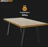 A table with black legs and a wooden top, presented against a black background with marketing text and a weight icon. Voir les images du produit
