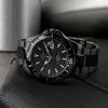A close-up shot of a black Jaguar men's watch with a metal band, resting on a black textured surface. Produktbild-Vorschau