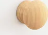 Two round wooden knobs are shown against a white background. Náhľad obrázku produktu