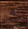A close-up, blurry image of a dark brown, weathered-looking frame. Produktbild-Vorschau