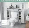 A white bathroom cabinet unit placed over a toilet, showcasing its storage shelves and adjustable features. Náhled obrázku produktu