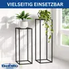 Two black metal plant stands with plants on them, placed indoors near a window. Anteprima dell’immagine prodotto