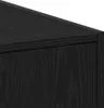 A close-up, angled shot of the corner of a black wooden cabinet, highlighting the wood grain texture. Produktbild-Vorschau
