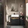 A modern bathroom with a vanity, sink, mirror, and storage cabinet. Náhled obrázku produktu