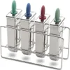 A set of four stainless steel popsicle molds with colored handles in a metal stand. Produktbild-Vorschau