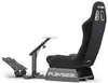 A black gaming chair with a pedal platform and a steering wheel mount, shown on a white background. Produktbild-Vorschau