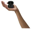 A hand holding a pair of black wireless earbuds in their charging case. Anteprima dell’immagine prodotto
