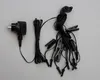 A black power adapter and a string of black lights with clips are laid out on a gray background. Produktbild-Vorschau