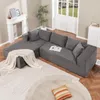 A sectional sofa in a living room setting with a fireplace, plant, and rug. Produktbild-Vorschau