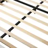 A close-up view of the wooden slats and metal frame of a bed base. Náhľad obrázku produktu