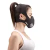Side profile of a woman wearing a black training mask. Anteprima dell’immagine prodotto