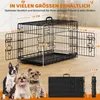 A dog crate with dimensions labeled, and three small dogs in the foreground. Podgląd zdjęcia produktu