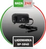 A black power adapter with a cable and plug, presented on a gradient background with green and red arcs. Náhľad obrázku produktu