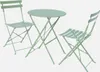 A light green bistro table and two chairs set against a plain background. Produktbild-Vorschau