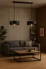 A living room scene with a sofa, coffee table, and pendant lights. Náhled obrázku produktu