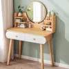 A modern vanity table with a round mirror and shelves, decorated with cosmetics and a small plant. Podgląd zdjęcia produktu
