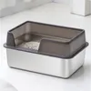 A close-up view of a stainless steel cat litter box with a gray plastic rim and litter inside, placed on a light-colored floor. Náhľad obrázku produktu