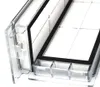 A close-up view of a clear plastic filter housing with a black rubber seal and white filter material inside. Produktbild-Vorschau