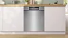 A stainless steel dishwasher is installed under a wooden countertop in a modern kitchen. Anteprima dell’immagine prodotto
