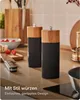 A kitchen counter with salt and pepper grinders, tomatoes, and a knife. Produktbild-Vorschau