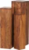 Three wooden pedestal tables of varying heights stand side-by-side against a white background. Produktbild-Vorschau