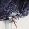 A close-up of a pool cover with red wires connected to a metal clamp. Produktbild-Vorschau