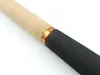 Close-up of a fishing rod handle with cork and black grip, featuring an orange band with the brand name. Produktbild-Vorschau