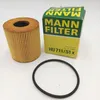 A new MANN FILTER oil filter, its packaging, and a rubber O-ring are displayed on a white background. Voir les images du produit