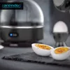 An electric egg cooker with prepared hard-boiled eggs. Anteprima dell’immagine prodotto