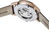 Close-up view of the back of a watch with a leather strap. Produktbild-Vorschau