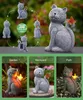 A collage showing a solar-powered cat statue with a butterfly, demonstrating different views and placement options in a garden, backyard, and path setting. Produktbild-Vorschau