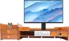 A wooden monitor stand with drawers and a monitor on top, set against a white background. Podgląd zdjęcia produktu