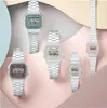 A collection of Casio digital watches with metal bands, displayed in various pastel colors against a layered background. Voir les images du produit