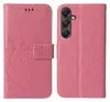 A pink flip cover phone case with a floral and butterfly design is shown open, revealing the inside and the phone it is designed to hold. Produktbild-Vorschau
