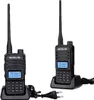 Two black Retevis RT85 walkie-talkies are shown in their charging docks, with power cords and plugs visible. Produktbild-Vorschau