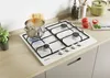 A white gas stovetop with a pot of boiling pasta and spaghetti on it, set on a kitchen counter. Voir les images du produit