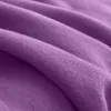 A close-up, detailed view of a soft, textured purple fleece fabric, showing its folds and texture. Produktbild-Vorschau