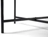 Close-up of the metal legs and crossbars of a table. Produktbild-Vorschau