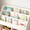 A white children's bookshelf filled with colorful books. Podgląd zdjęcia produktu