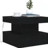 A black wooden side table with a plant, a cup of coffee, and books on top. Produktbild-Vorschau