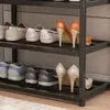 A shoe rack filled with various shoes. Podgląd zdjęcia produktu