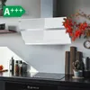 A modern kitchen scene featuring a white glass range hood above a stovetop, with decorative items on the counter. Produktbild-Vorschau