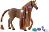 A toy horse with long brown hair decorated with colorful hair clips and accessories. Voir les images du produit