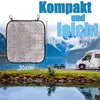 A silver seat cushion is shown in a scenic outdoor setting with a lake, mountains, and a camper van. Dimensions are indicated. Produktbild-Vorschau